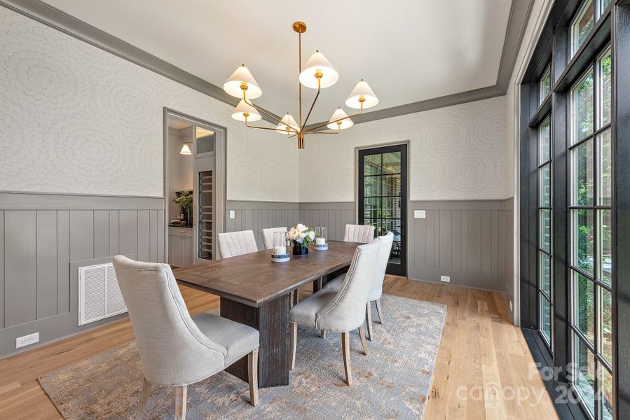 Butlers pantry and wet bar leading to the kitchen