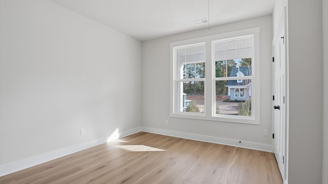 Functional secondary space with hardwood flooring and modern touches in an exceptional layout located at Pelham Crossing