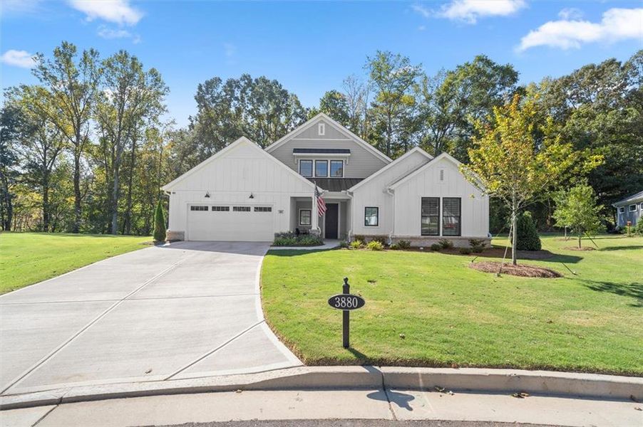 Front exterior of a new home in The Courtyards by The Manor, Alpharetta, GA, highlighting curb appeal (Image 2). Front exterior of a new home in The Courtyards by The Manor, Alpharetta, GA, highlighting curb appeal (Image 2).