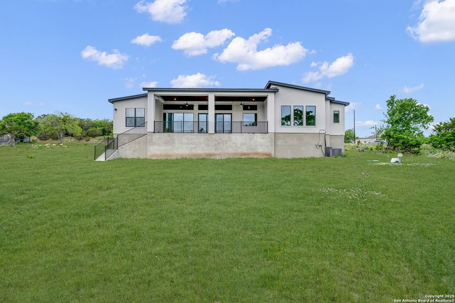 Front exterior of a new home in , Spring Branch, TX, highlighting curb appeal (Image 18). Front exterior of a new home in , Spring Branch, TX, highlighting curb appeal (Image 18).