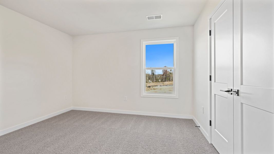 Spacious, unfurnished interior of a new home in Adams Glen, Greenville (Image 24).