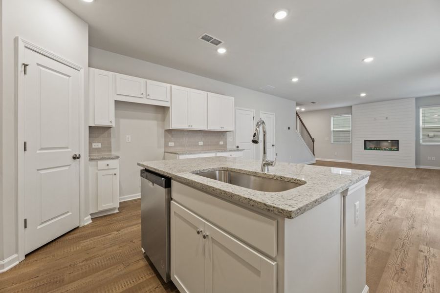 A kitchen with white cabinets. A kitchen with white cabinets.