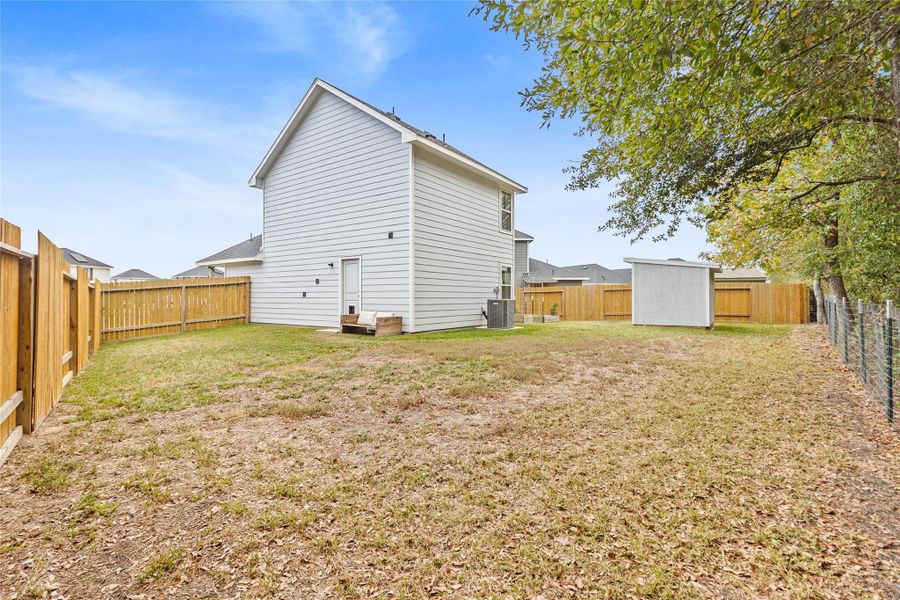 Exterior details and patio area of a home in Marie Village, Conroe (Image 2).