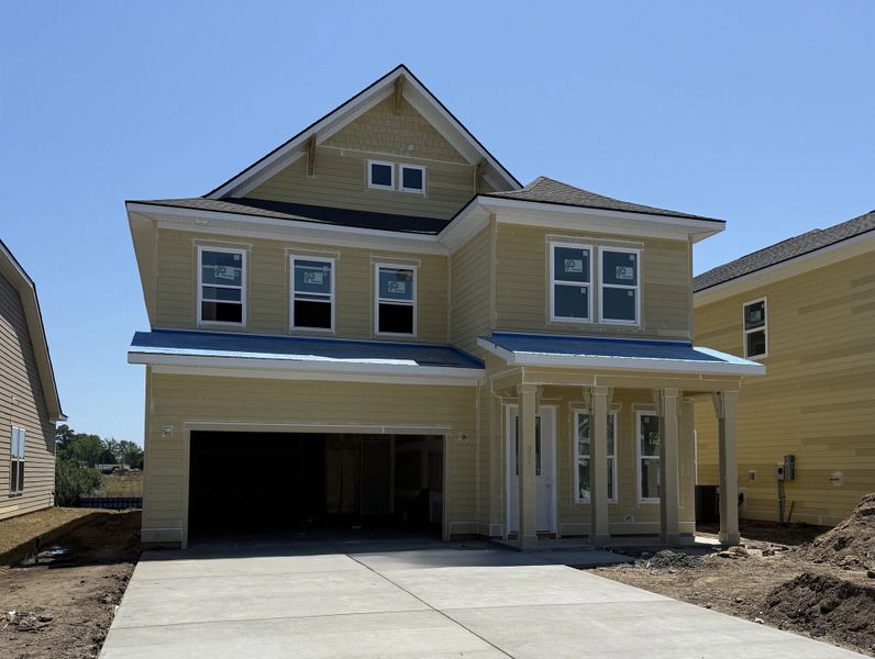 Front exterior of a new home in Blue Heron Retreat, Little River, SC, highlighting curb appeal (Image 2). Front exterior of a new home in Blue Heron Retreat, Little River, SC, highlighting curb appeal (Image 2).