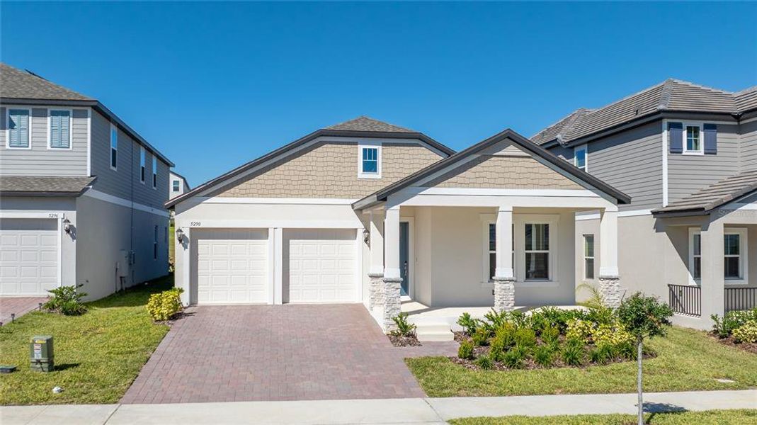 Front exterior of a new home in Silverleaf Reserve, Winter Garden, FL, highlighting curb appeal (Image 2).