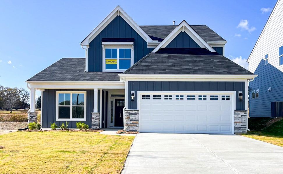 Front exterior of a new home in Founders Club, Moore, SC, highlighting curb appeal (Image 1).
