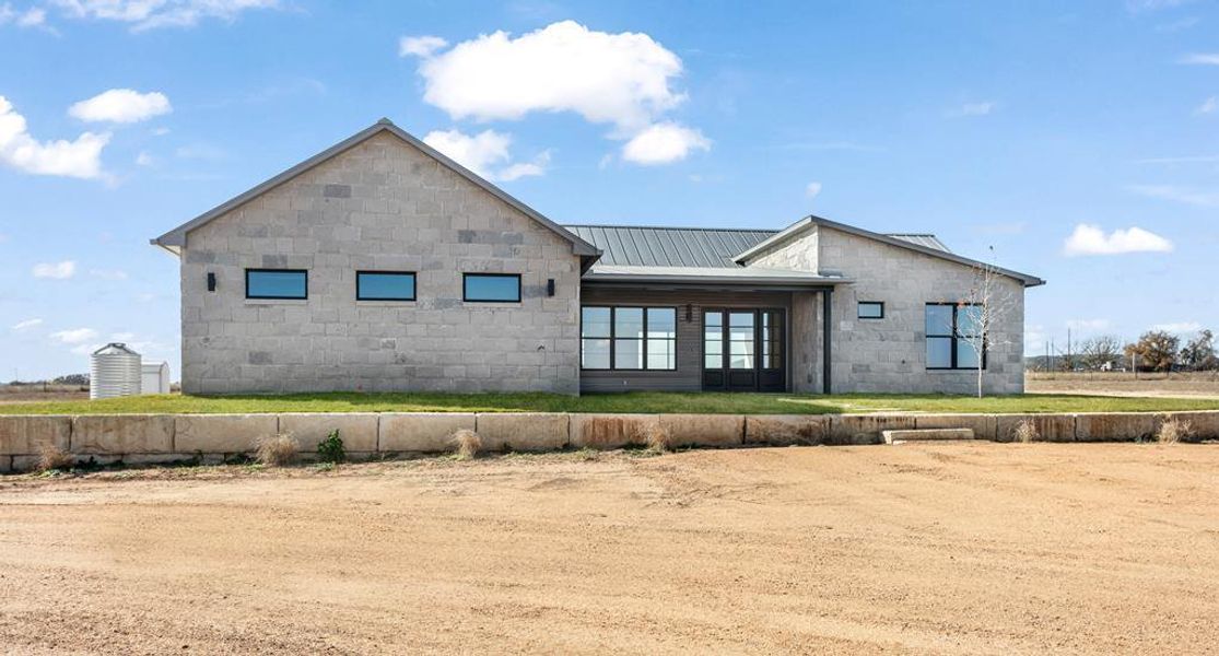 Rear view of property with a metal roof Rear view of property with a metal roof