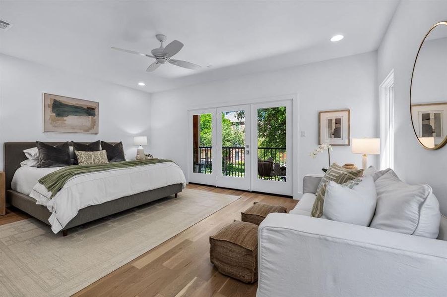 Bedroom featuring french doors, light wood-type flooring, access to outside, and ceiling fan