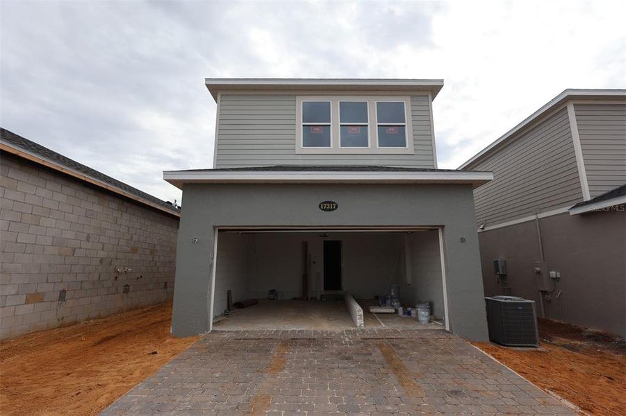 In-progress construction of a new home in Lake Star at Ovation, Winter Garden, FL (Image 21).