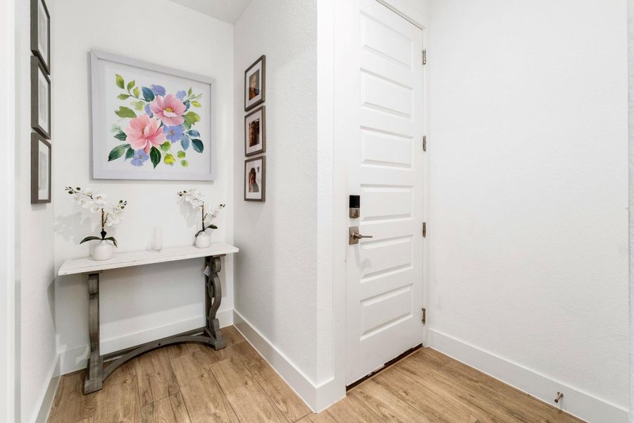 Door leading to the garage - the nook is great for a reading corner, built-in's, mudroom area, mini library, or anything your heart desires!!