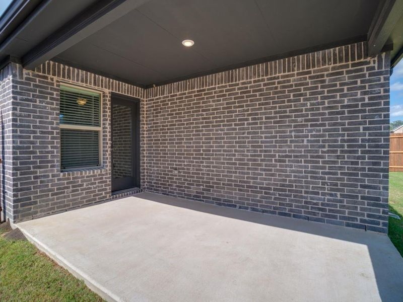 Exterior details and patio area of a home in Southridge - Signature Series, McKinney (Image 3). Exterior details and patio area of a home in Southridge - Signature Series, McKinney (Image 3).