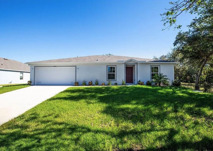 Front exterior of a new home in Lehigh Acres, Lehigh Acres, FL, highlighting curb appeal (Image 1). Front exterior of a new home in Lehigh Acres, Lehigh Acres, FL, highlighting curb appeal (Image 1).