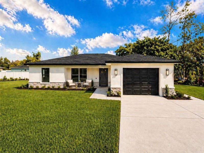 Front exterior of a new home in , Dunnellon, FL, highlighting curb appeal (Image 19).