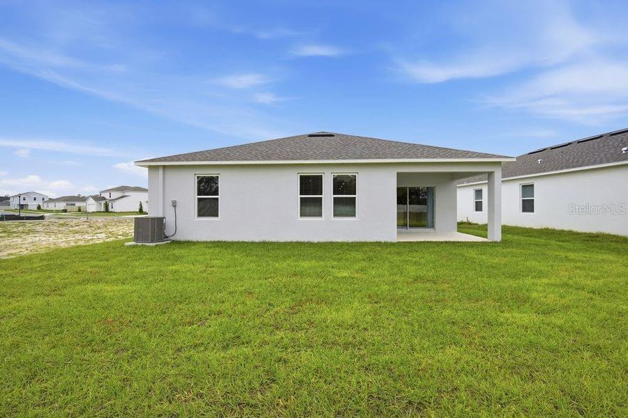 Exterior details and patio area of a home in Palm Wind, Hudson (Image 3).