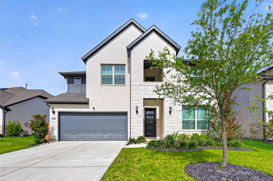 Front exterior of a new home in Sunterra, Katy, TX, highlighting curb appeal (Image 1). Front exterior of a new home in Sunterra, Katy, TX, highlighting curb appeal (Image 1).