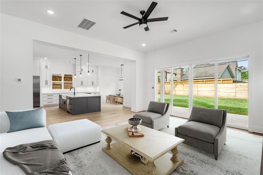 Here is a look from the living room towards the kitchen and dining areas, showing you the open concept home. *Virtual staging has been added*