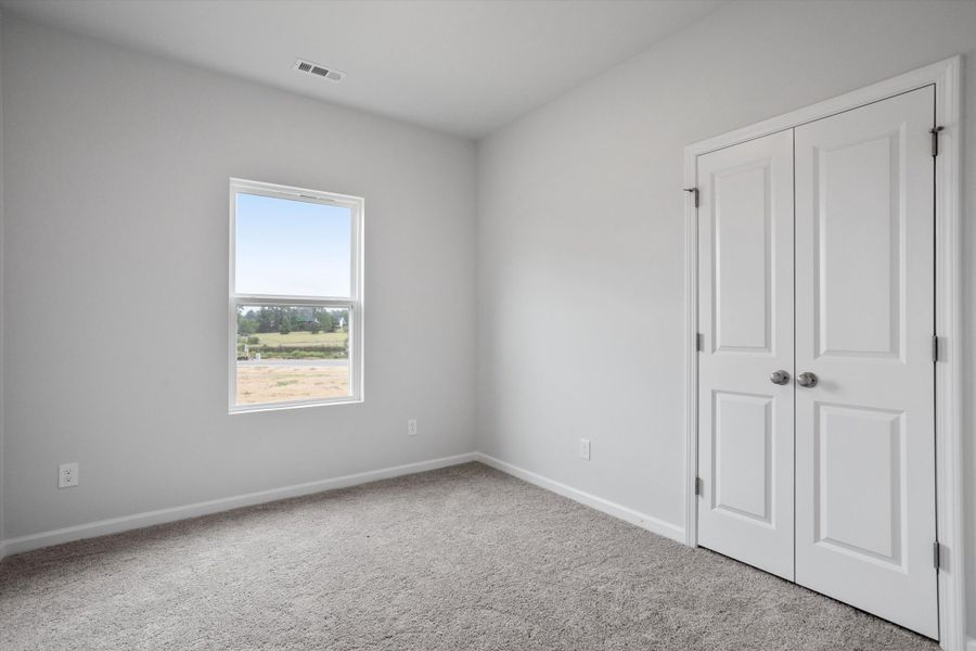 Spacious, unfurnished interior of a new home in Cambridge Reserve, Angier (Image 27).