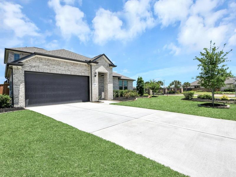Front exterior of a new home in Lago Mar, Texas City, TX, highlighting curb appeal (Image 26).