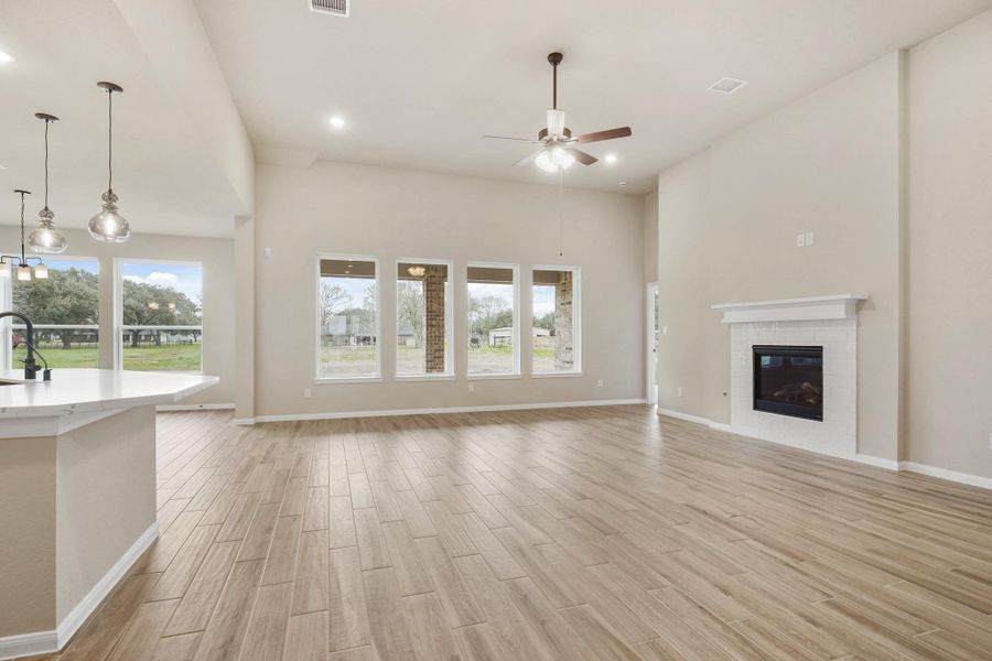Great room with cozy fireplace (*Photo not of actual home and used for illustration purposes only.) Great room with cozy fireplace (*Photo not of actual home and used for illustration purposes only.)
