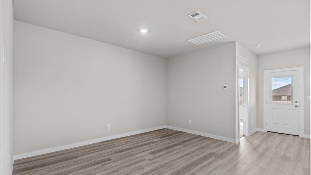 Representative unfurnished interior of a home built from the JUSTIN by D.R. Horton in Homestead at Parks Bell Ranch, Odessa (Image 11).