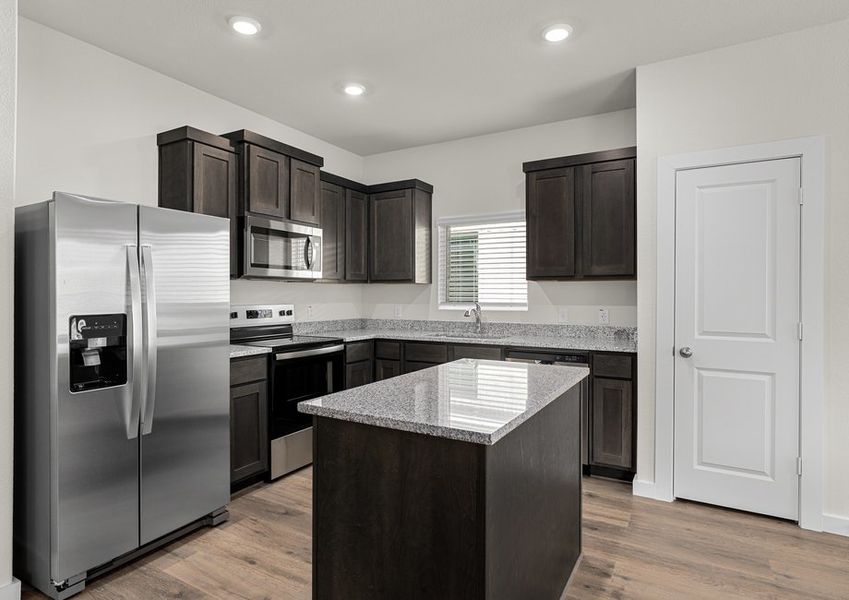 The kitchen has stainless-steel, energy-efficient appliances.