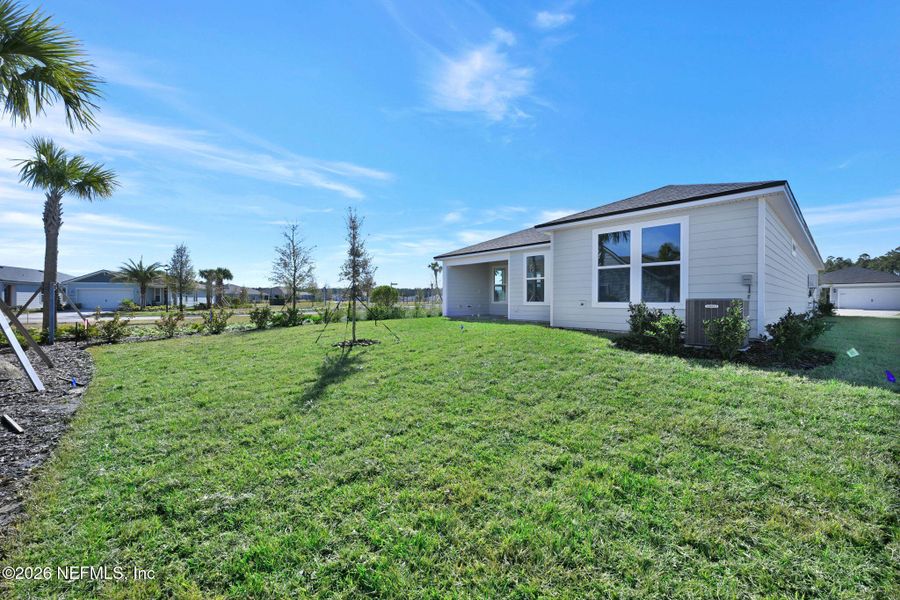 Exterior details and patio area of a home in Del Webb Wildlight, Yulee (Image 19).