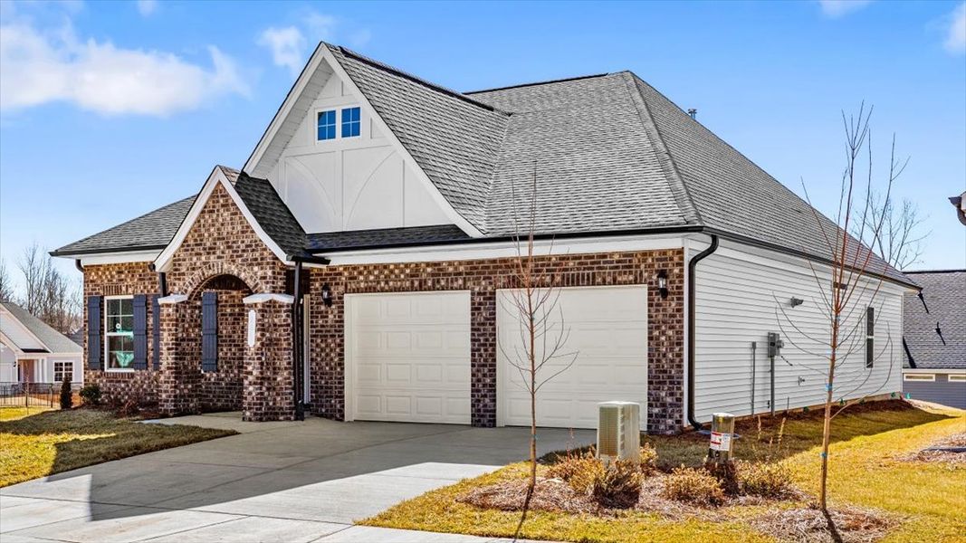 Front exterior of a new home in Brayden, Advance, NC, highlighting curb appeal (Image 17). Front exterior of a new home in Brayden, Advance, NC, highlighting curb appeal (Image 17).