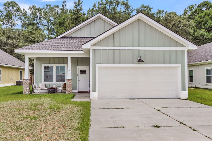 Front exterior of a new home in , Huger, SC, highlighting curb appeal (Image 24). Front exterior of a new home in , Huger, SC, highlighting curb appeal (Image 24).