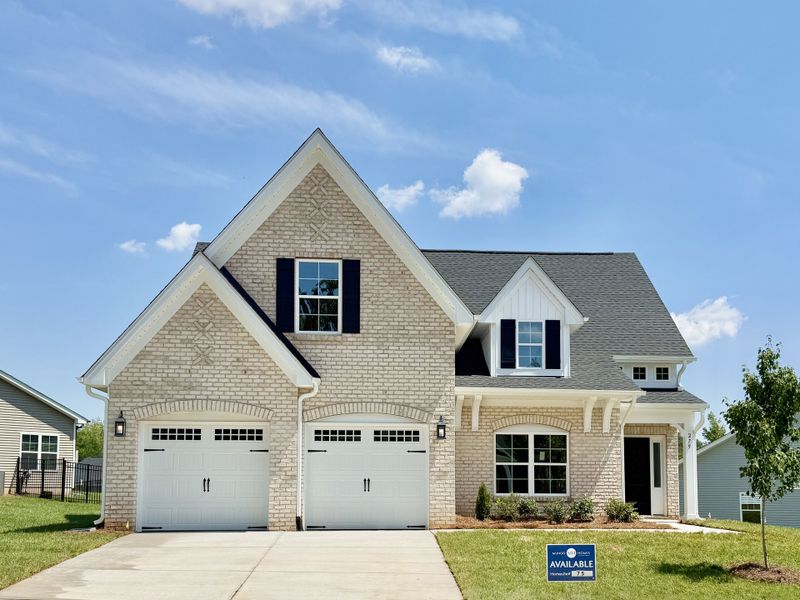Front exterior of a new home in Brayden, Advance, NC, highlighting curb appeal (Image 1). Front exterior of a new home in Brayden, Advance, NC, highlighting curb appeal (Image 1).