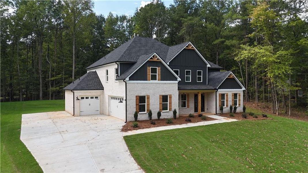 Front exterior of a new home in , Monroe, GA, highlighting curb appeal (Image 17). Front exterior of a new home in , Monroe, GA, highlighting curb appeal (Image 17).