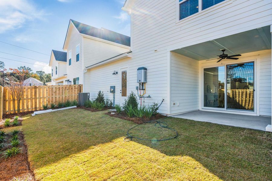 Exterior details and patio area of a home in , Johns Island (Image 29).
