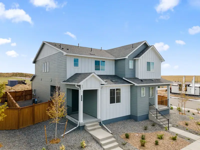 Front exterior of a new home in Sky Ranch, Watkins, CO, highlighting curb appeal (Image 17).