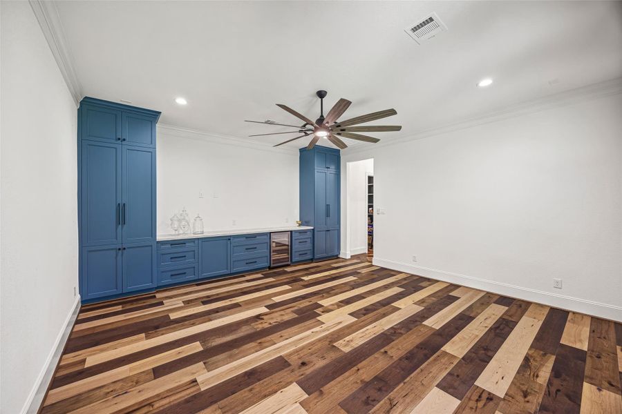 Downstairs entertainment space complete with a sleek built-in and wine fridge, ideal for gatherings, game nights, or casual lounging. Downstairs entertainment space complete with a sleek built-in and wine fridge, ideal for gatherings, game nights, or casual lounging.
