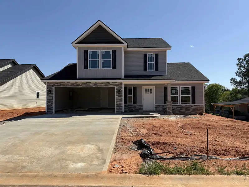Front exterior of a new home in Mills Gin, Campobello, SC, highlighting curb appeal (Image 1).
