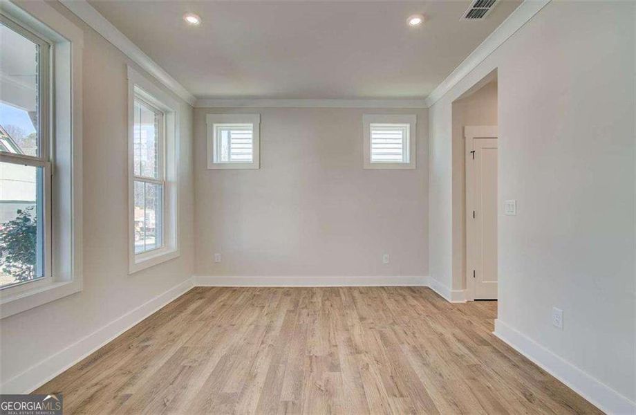 Spacious, unfurnished interior of a new home in The Paddocks at Doc Hughes, Buford (Image 34).