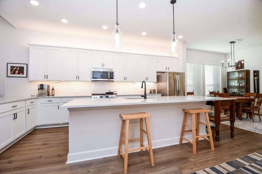Stainless steel appliances in this polished, clean kitchen. Stainless steel appliances in this polished, clean kitchen.