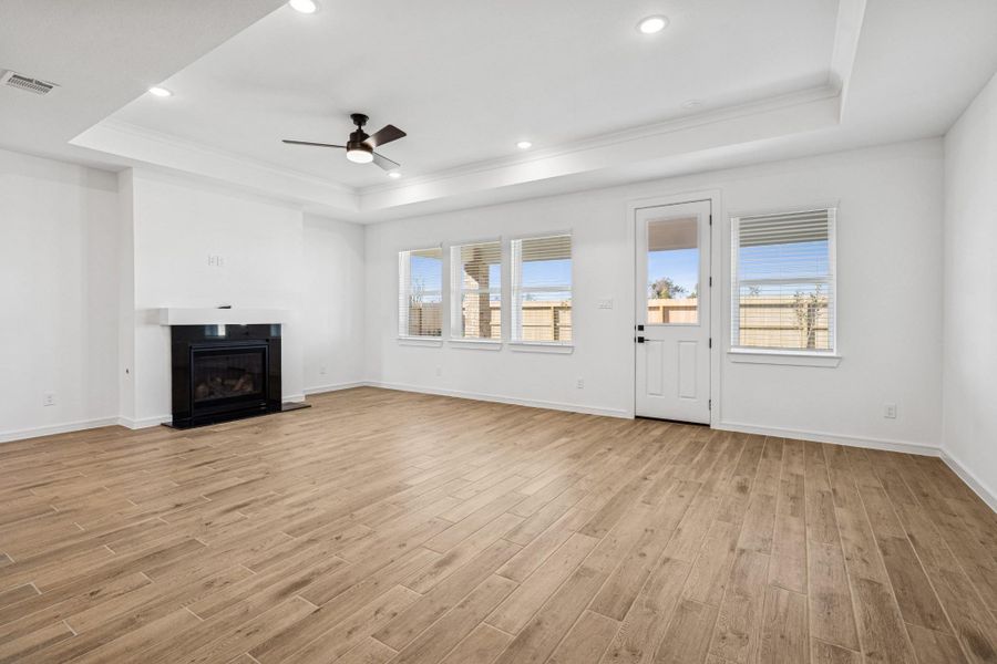 Open dining area and great room with cozy fireplace