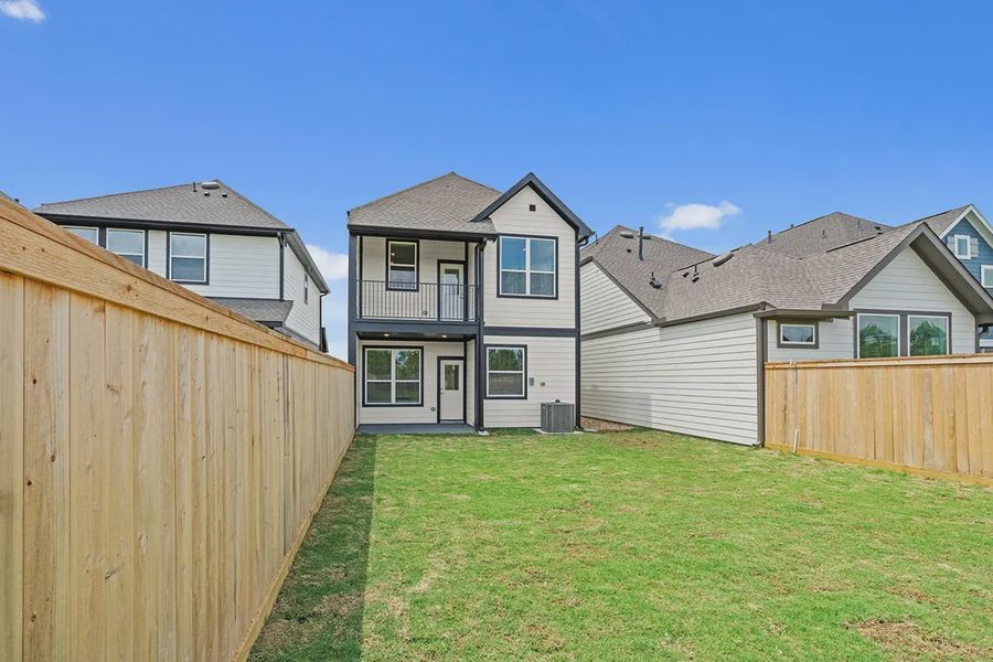 Exterior details and patio area of a home in Bridgeland Chateaus, Cypress (Image 22).