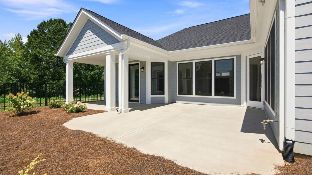 Exterior details and patio area of a home in The Courtyards at Hodges Farm, Charlotte (Image 3).