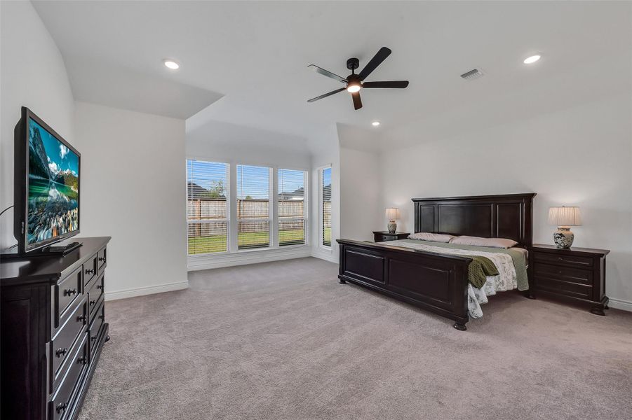 Large primary bedroom with sitting area