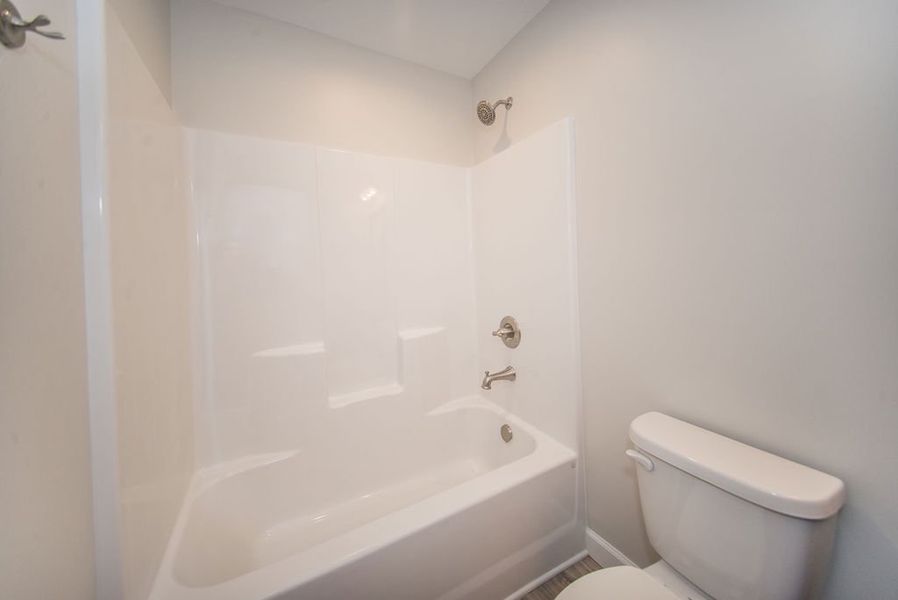 Representative furnished interior of a home built from the Quincy by Enchanted Homes in Hampshire Heights, Moore (Image 19).