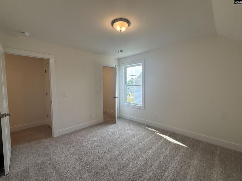 Spacious, unfurnished interior of a new home in Cottages at Roofs Pond, West Columbia (Image 34).