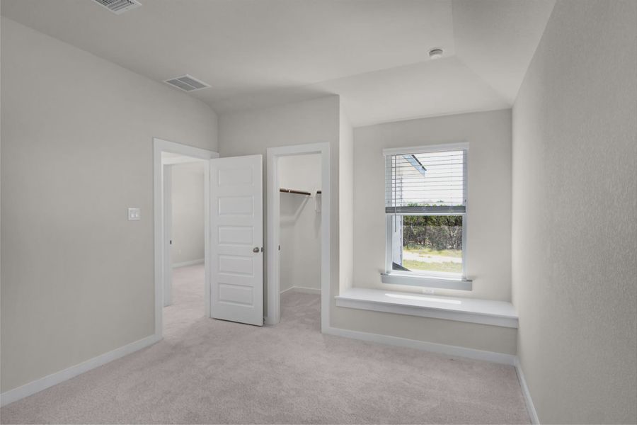 Representative unfurnished interior of a home built from the Warner by Chesmar Homes in The Grove at Blackhawk, Pflugerville (Image 9).