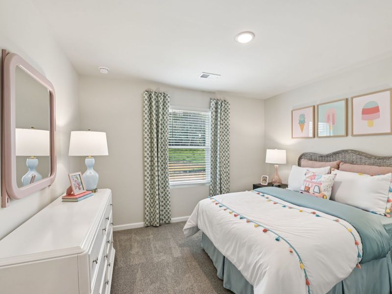 Secondary bedroom in the Chatham floorplan at a Meritage Homes community in Mebane, NC. Secondary bedroom in the Chatham floorplan at a Meritage Homes community in Mebane, NC.