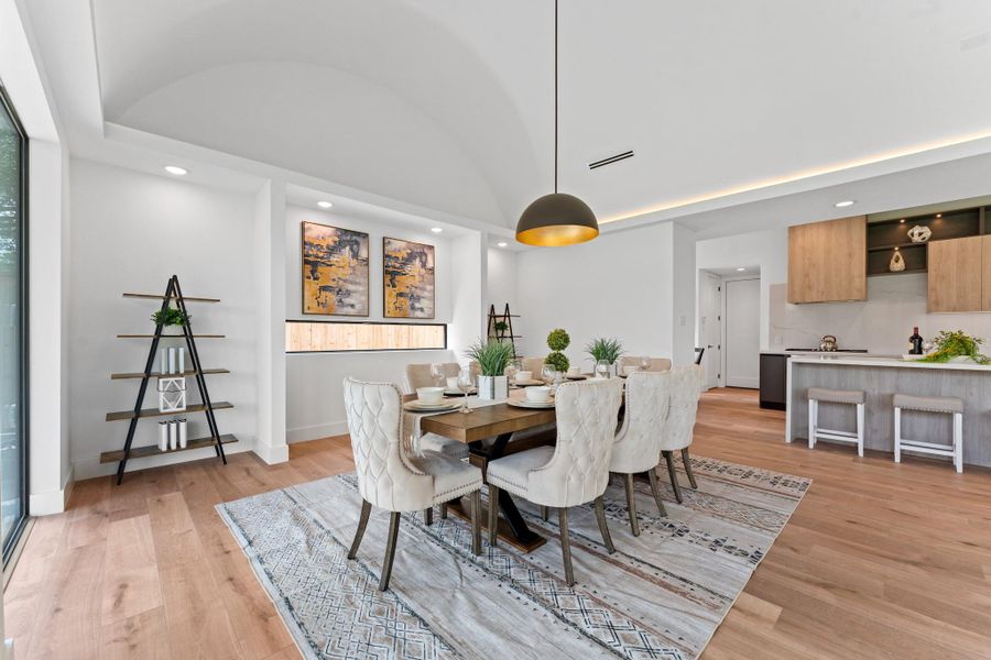 Entertain beautifully under soaring ceilings and a sculptural modern chandelier that casts a warm glow day or night. Entertain beautifully under soaring ceilings and a sculptural modern chandelier that casts a warm glow day or night.