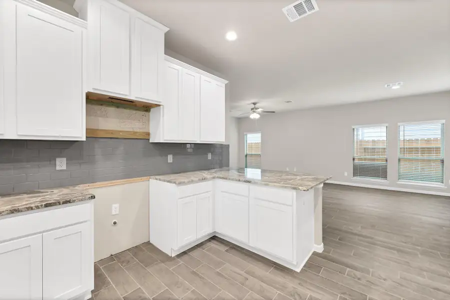 Furnished interior view inside a new home in Enclave at Willis, Willis (Image 7). Furnished interior view inside a new home in Enclave at Willis, Willis (Image 7).