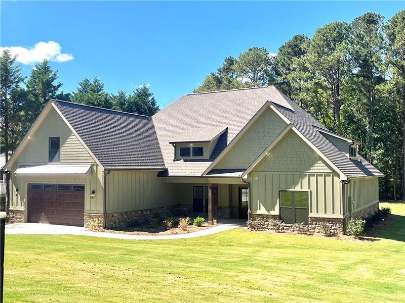 Front exterior of a new home in , Calhoun, GA, highlighting curb appeal (Image 18).