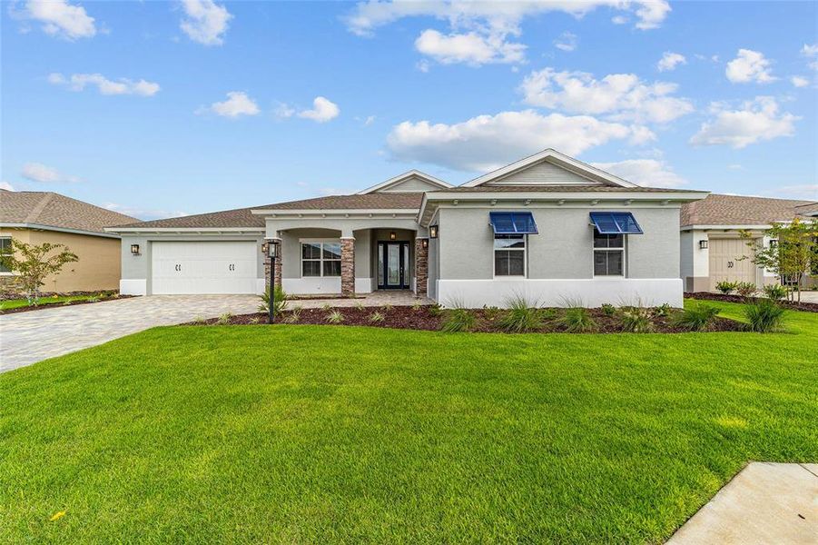 Front exterior of a new home in , Ocala, FL, highlighting curb appeal (Image 25).