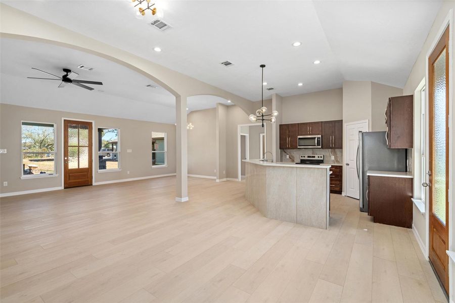 From this perspective, noticethe perfect blend of form andfunction: open living, dining,and kitchen areas ideal forfamily gatherings or hostingfriends.