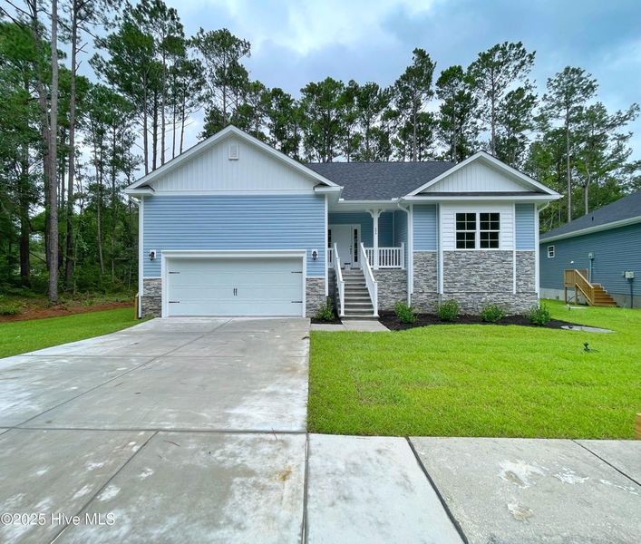 Front exterior of a new home in Mill Creek Cove, Bolivia, NC, highlighting curb appeal (Image 2).